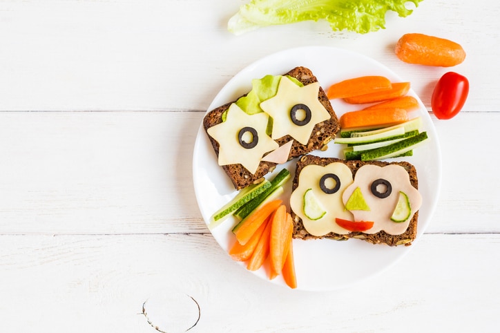 pieces of a sandwich cut in fun ways to make a face