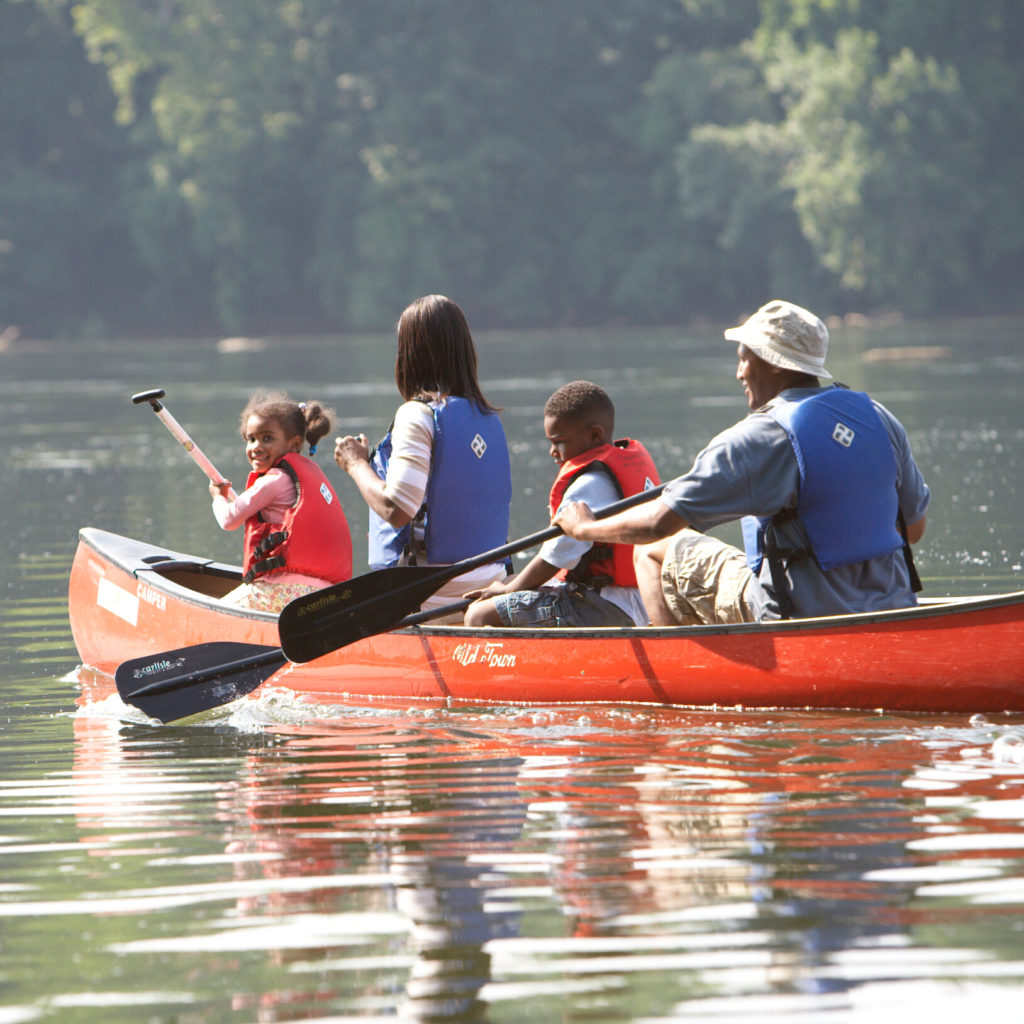 Family canoeing on James River