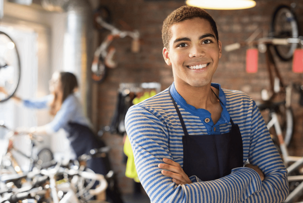 Teen working in bike shop
